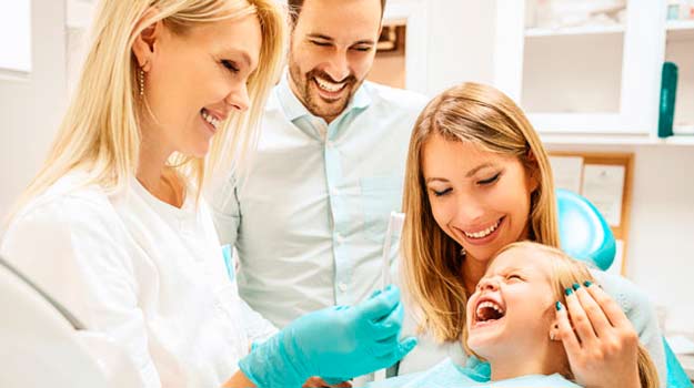 A Family Having A Happy Time With Dentist Appointment